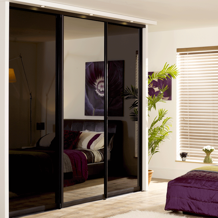 Monaco sliding wardrobe doors with black frame / black glass outer doors and grey mirror middle door