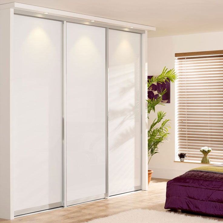 White Sliding Wardrobe Doors - Monaco Silver Frame w/ Pure White Glass Panels.